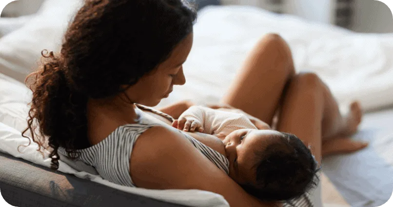 A mother breastfeeding her newborn